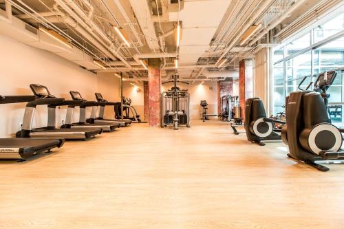a gym with treadmills and cardio machines at Hotel Kabuki, part of JdV by Hyatt in San Francisco