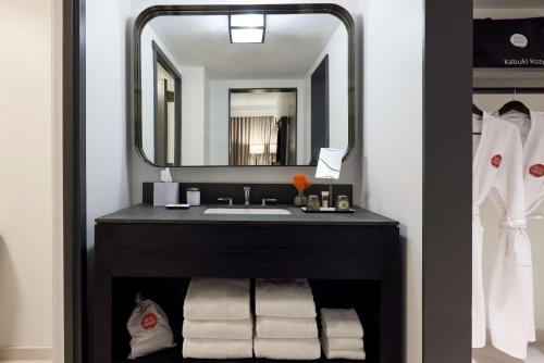 a bathroom with a sink and a mirror at Hotel Kabuki, part of JdV by Hyatt in San Francisco