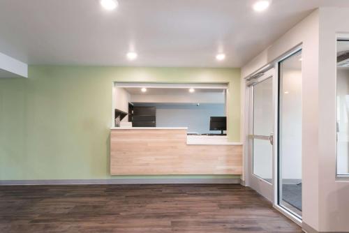 an empty room with a mirror and a door at WoodSpring Suites Philadelphia Northeast in Philadelphia