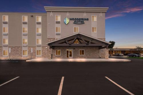 a large building with a parking lot in front of it at WoodSpring Suites Philadelphia Northeast in Philadelphia