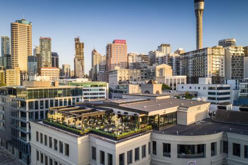 a view of a city skyline with tall buildings at QT Auckland in Auckland