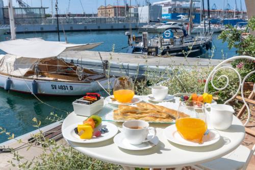 a table with a breakfast of toast and orange juice at Locanda da Toto in Genova