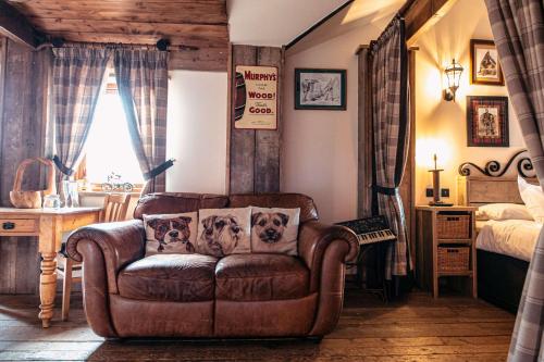 a living room with a couch and a bed at South Causey Inn in Stanley