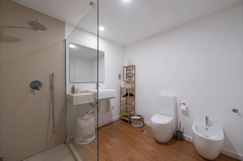 a bathroom with a shower and a toilet and a sink at Lazareto Mar by An Island Apart in Funchal