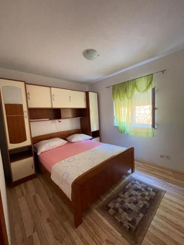 Postel nebo postele na pokoji v ubytování Apartman Jukic