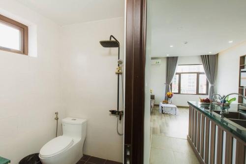 a bathroom with a toilet and a sink at Two-Bedrooms - POOL SEA VIEW - 6A - BLUE SEA APARTMENT in Da Nang