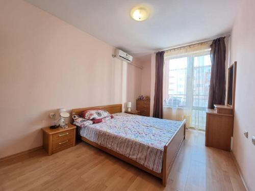 A bed or beds in a room at Privilege Fort beach Apartman Sveti Vlas 61m2