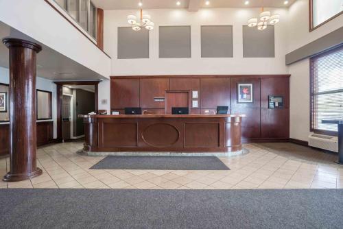 a large courtroom with a desk in a building at Sandman Hotel Saskatoon in Saskatoon