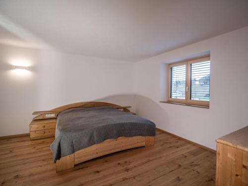 a bedroom with a bed and a window at Burtscherhof in Braz in Ausserbraz