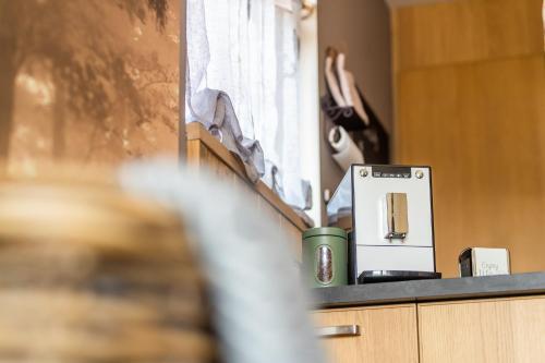 a coffee machine sitting on top of a counter at Relax B&B Lavendine Pure in Genk