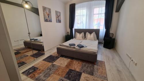 Postel nebo postele na pokoji v ubytování Apartment near Congress Centre I.