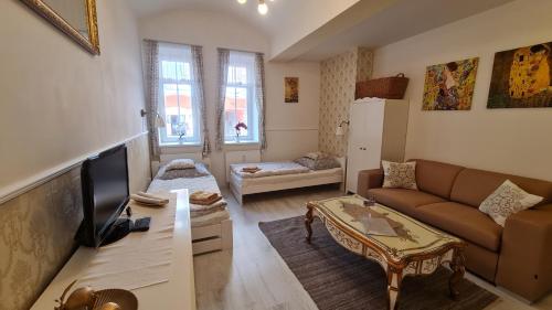 a small living room with a couch and a table at Studio near Congress Centre II. in Prague