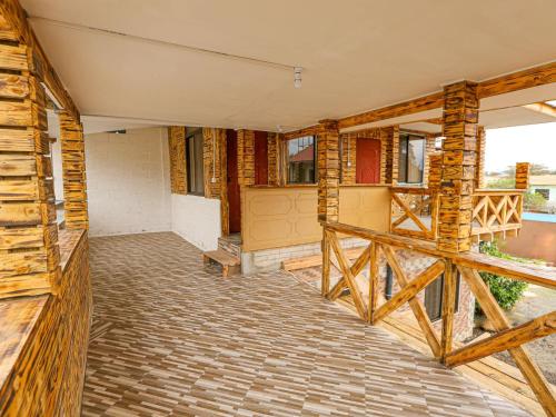 a house under construction with a porch at Arusha Safari Hostel in Arusha