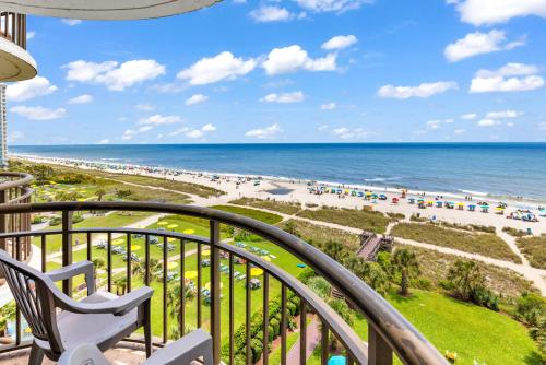 a balcony with a view of the beach at Spectacular Oceanview Condos in Myrtle Beach