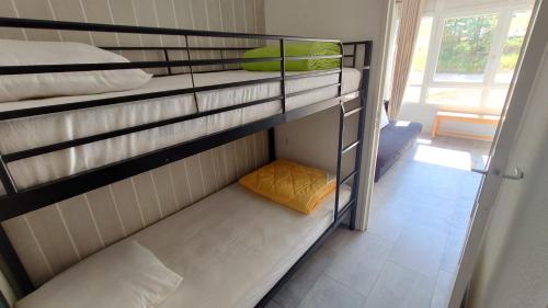 Двухъярусная кровать или двухъярусные кровати в номере Portillo