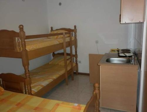 a kitchen with two bunk beds and a sink at Bojana Blue Retreat in Ulcinj