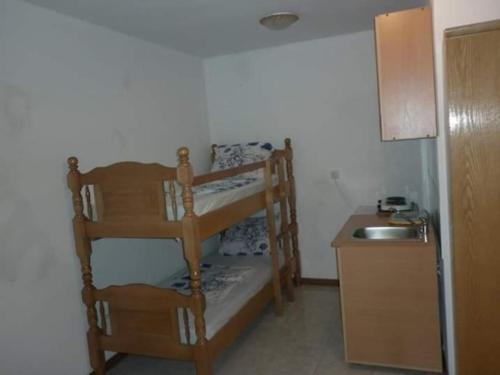 a room with a bunk bed and a sink at Bojana Blue Retreat in Ulcinj
