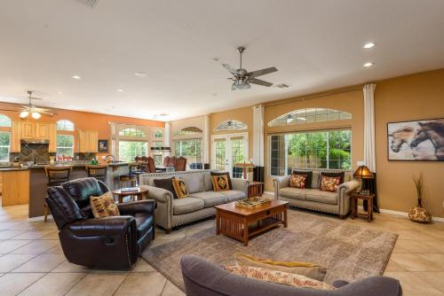 a large living room with couches and a kitchen at Casa Dynamite home in Cave Creek