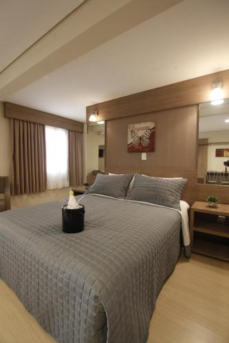 a bedroom with a large bed in a room at Klein Ville Dois Irmãos in Dois Irmãos