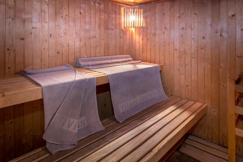 a inside of a sauna with a table in it at Vilar Rural De Sant Hilari Sacalm by Serhs Hotels in Sant Hilari Sacalm