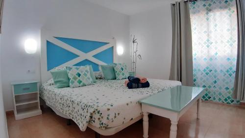 Postel nebo postele na pokoji v ubytování Casa Manba Corralejo