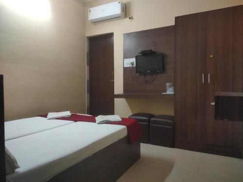 Postel nebo postele na pokoji v ubytování PLAZA GUEST HOUSE