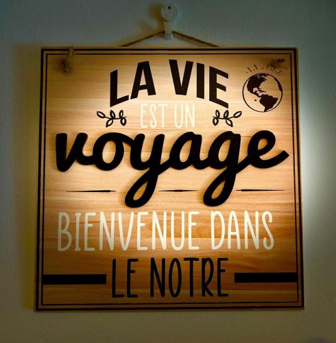 a sign that reads la we estumn voyage between nerve dancesle notice at Jolie petite Villa sur une presqu’île in Le Gosier