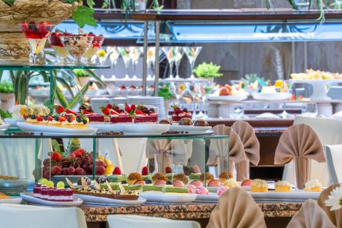 a buffet line with many different types of desserts at HVD Riviera Beach Ultra All Inclusive & Mineral Pool - Private Beach & Free Parking in Golden Sands