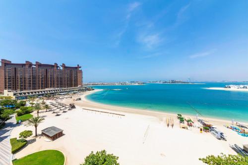 a view of the beach at the resort at Maison Privee - Beach Access Apt with Burj & Sea Views on The Palm in Dubai