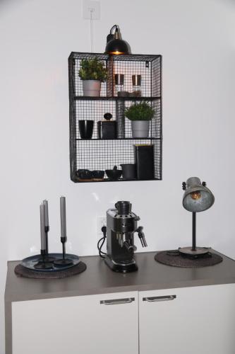 a kitchen with a counter with two burners on it at Lägenhetshotell Varvet in Ellös
