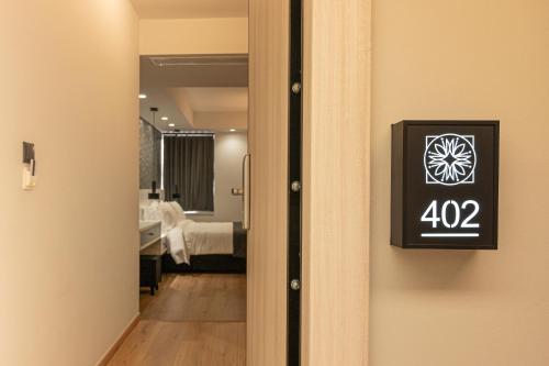 a room with a door with a sign on it at Ethereal Athεns in Athens