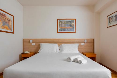 Postel nebo postele na pokoji v ubytování Catignano Hotel