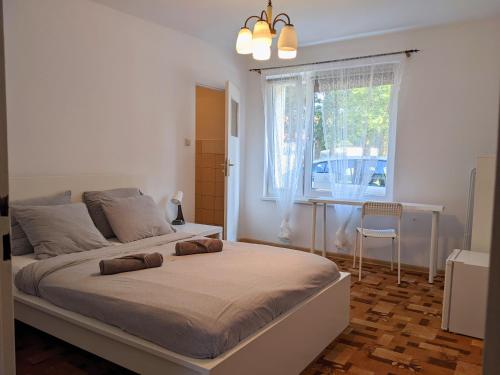 Posteľ alebo postele v izbe v ubytovaní Piaskowy Domek