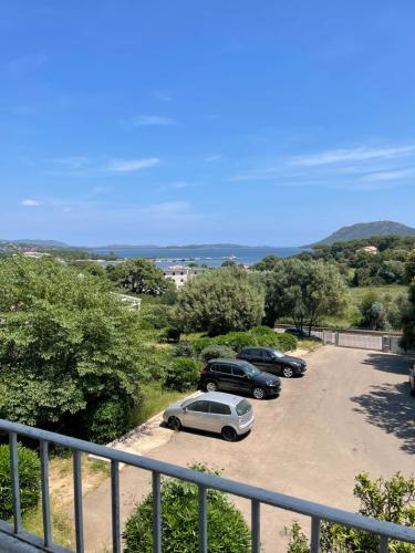 a group of cars parked in a parking lot at Appartement en centre - résidence privée, vue mer in Porto-Vecchio