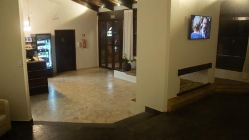 TV a/nebo společenská místnost v ubytování Essência Hotel Francisco Beltrão