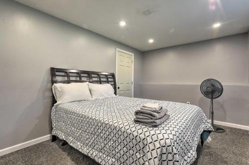 a bedroom with a bed and a fan at Vibrant Westerly Home with Private Pool and Yard! in Westerly