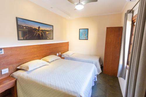 Postel nebo postele na pokoji v ubytování Hotel Imperium Village