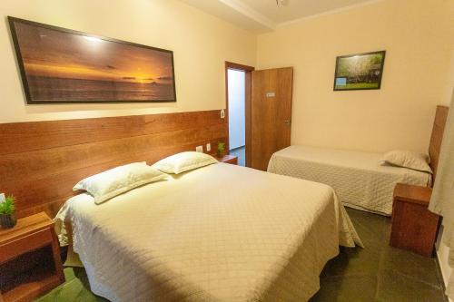 Postel nebo postele na pokoji v ubytování Hotel Imperium Village