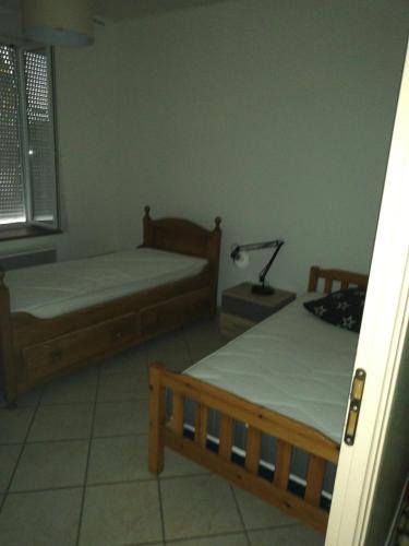 Un pat sau paturi într-o cameră la Appartement 5 couchages 35mn du Luxembourg