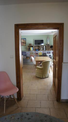 a living room with a table and a chair at Fantazja Góra Św Anny in Góra Świętej Anny
