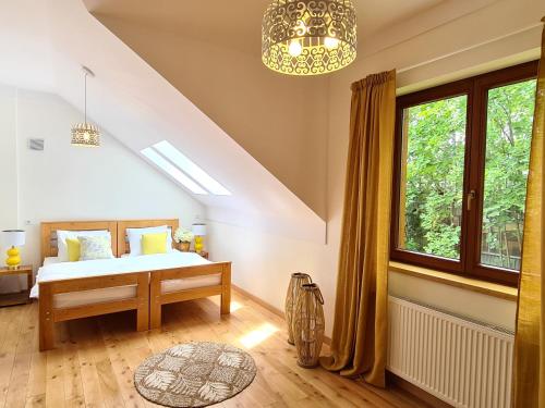 a bedroom with a bed and a window at Gościniec Iłżanka in Iłża