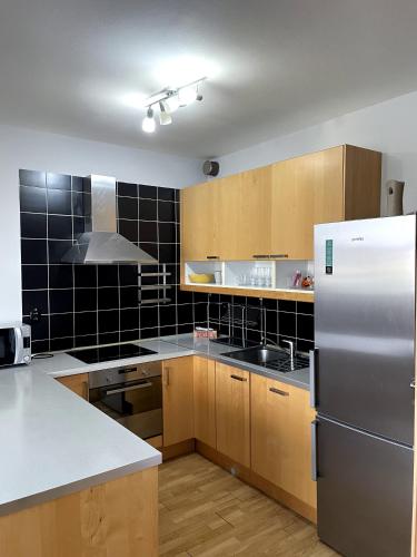 Kuchyň nebo kuchyňský kout v ubytování Apartments
