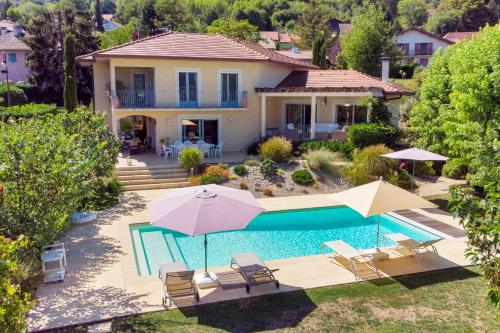 an aerial view of a house with a swimming pool at Le Mas de Sevrier in Sévrier