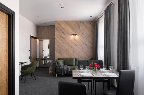 a dining room with a table and chairs at Ribas Rooms Bila Tserkva in Bila Tserkva