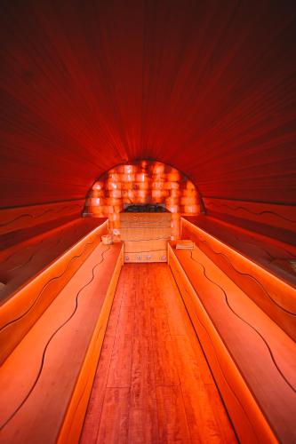 a red tunnel with a bench in it at Domaine Des Hautes Fagnes in Ovifat