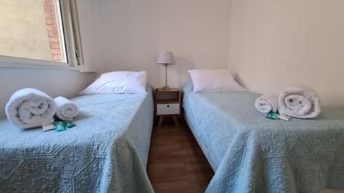 Una cama o camas en una habitación de Cozy apartment in the heart of Cañitas