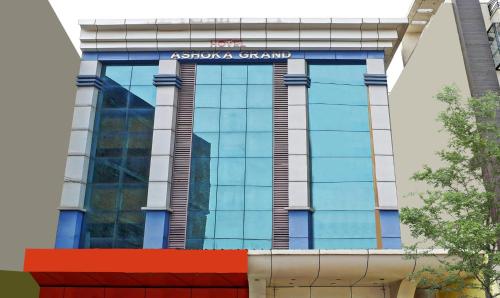 a building with a sign on the side of it at Itsy By Treebo - Ashoka Grand in Varanasi