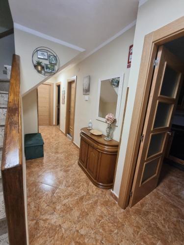 a hallway with a vanity and a mirror in a room at CA' REMEDIOS in Felechosa