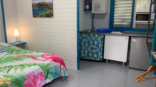 a hospital room with a bed and a counter at an eol caraibes in Trois-Rivières