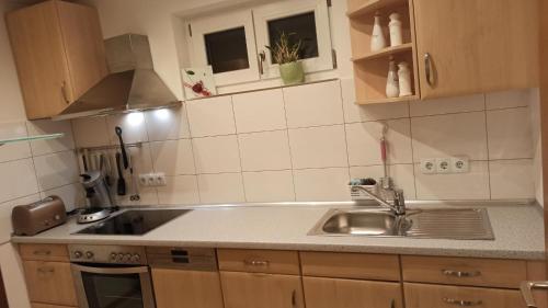 a kitchen with a sink and a counter top at Ferienwohnung Frank in Passau